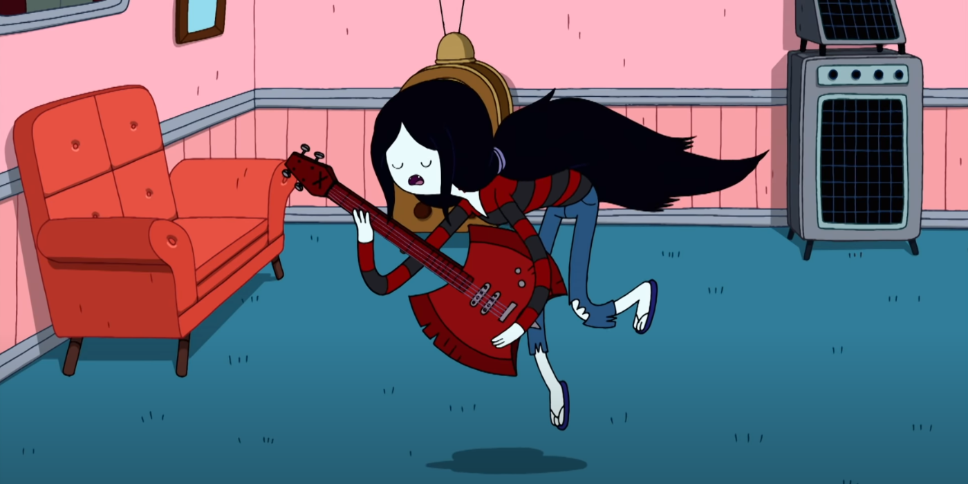 Marceline singing the fry song on her axe guitar.